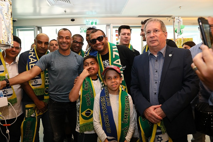 Dr. Michael Halberthal with some of the Brazilian Soccer Legends. Photo credit: Pioter Fliter