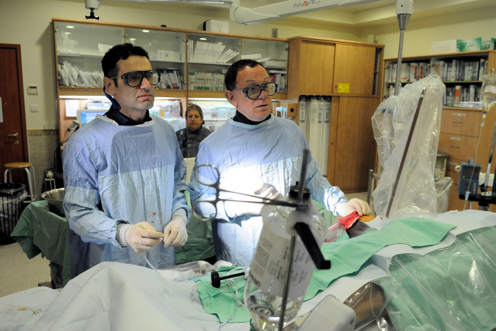 Professor Rafi Beyar (R) and a colleague during a procedure. Photo Credit: Pioter Fliter