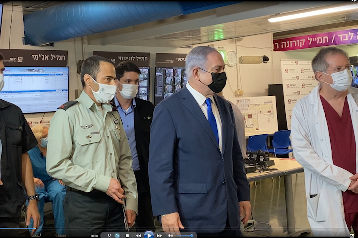 Touring Rambam's COVID-19 Command Center. (Left) Chief Medical Officer Brigadier General Elon Glassberg, (middle) Prime Minister Benjamin Netanyahu , and (right) Dr. Michael Halberthal. Photography: Rambam HCC