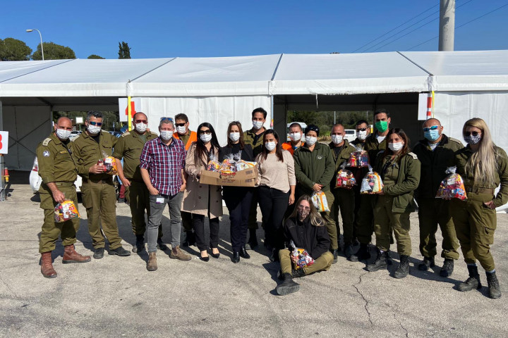 Members of the Purchasing Department deliver Mishloach Manot to IDF soldiers. Photography: Rambam HCC