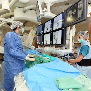 
Dr. Eitan Abergel performs a brain catheterization.
Photographer: Pioter Fliter