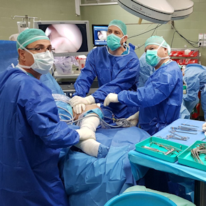 ​Dr. Sachs and Dr. Bezalel performing the
meniscus transplant on the young soldier.
Photo credit: RHCC
