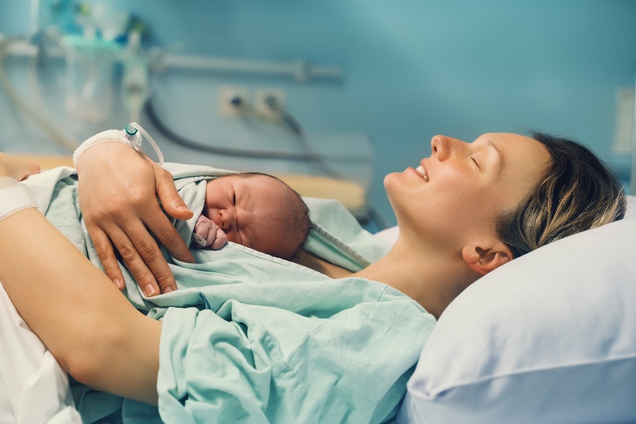 Woman with baby in hospital